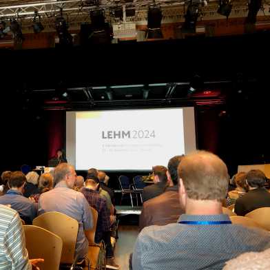 Picture of audience sitting infront of stage